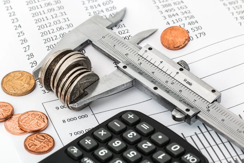 Canva - Coins and Calculator on a Invoice